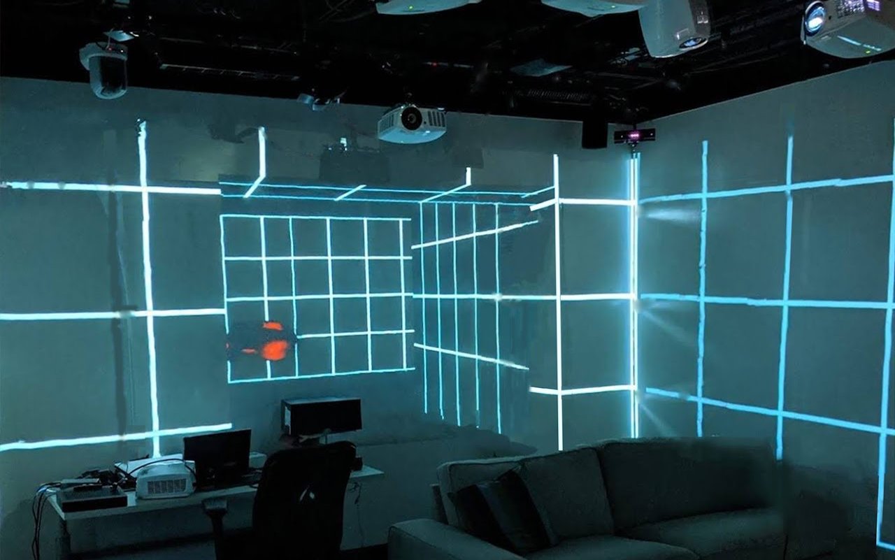 Lab projection room with a glowing grid projected on the walls